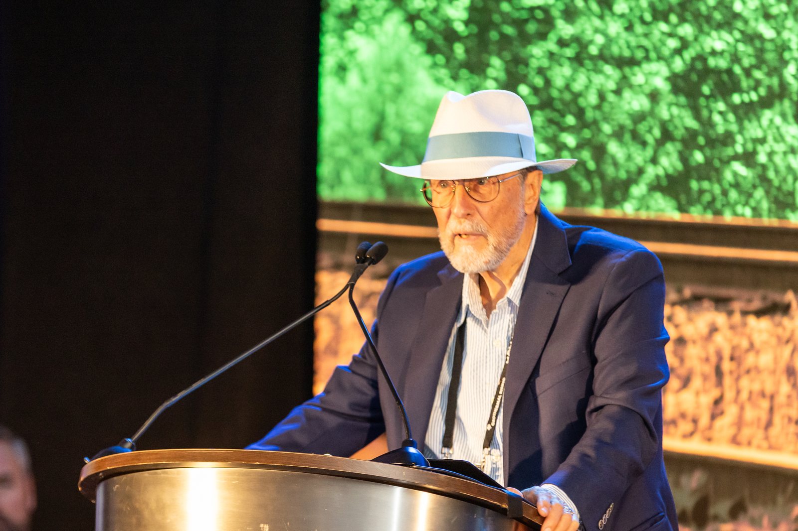Peter Malin speaking at the podium during the award presentation